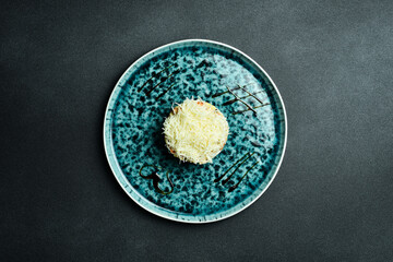 Salad with chicken, boiled vegetables and mayonnaise. Close-up, gray background.