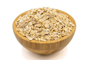Oatmeal or Oat flakes isolated on white background. Oatmeal in wooden bowl. Close up