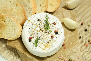 Close-up of French camembert cheese ready to be baked in the oven