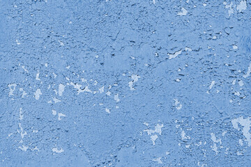 Concrete wall with old cracked, peeling flaking blue paint. Weathered rough painted surface with patterns of cracks and peeling, grunge, aged texture. Background, backdrop, wallpaper, design element