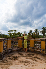 European woman on the terrace of a mansion in Sri Lanka