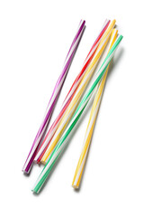 Different plastic drinking straws on white background