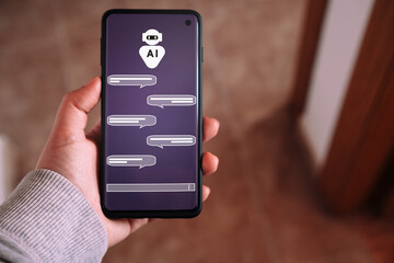 Obraz premium Woman showing smartphone while using a chatbot. Command prompt AI concept. Artificial Intelligence. Futuristic technology transformation.