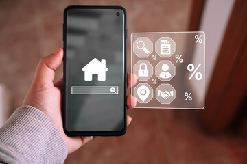 Woman use smartphone with digital interface of house hunting. Buy house concept. Real estate. Location, energy efficiency rating and property value. Virtual screen. Global inflation economic situation