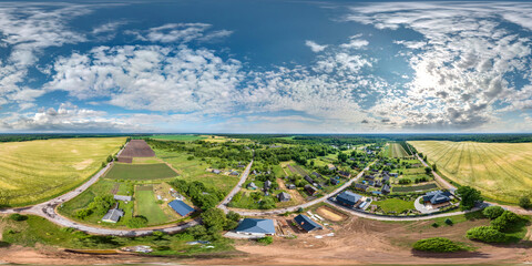 aerial full seamless spherical hdri 360 panorama view above green eco village with private...
