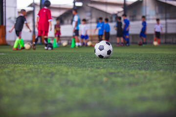 Soccer ball tactics cone on a grass field with for training