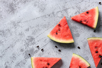 Pieces of fresh watermelon on blue grunge background