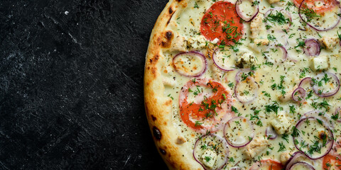 Traditional pizza with chicken, tomatoes and cheese. Takeaway food. On a black stone background. Rustic style.