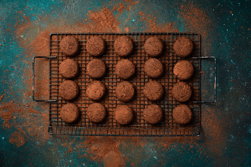 Chocolate Cookies, cocoa powder, chocolate and cocoa beans. Sweets, pastries, brownies On a dark background. Top view.