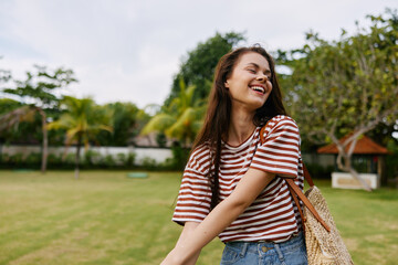 freedom woman beautiful park summer hat lifestyle t-shirt smiling walk nature