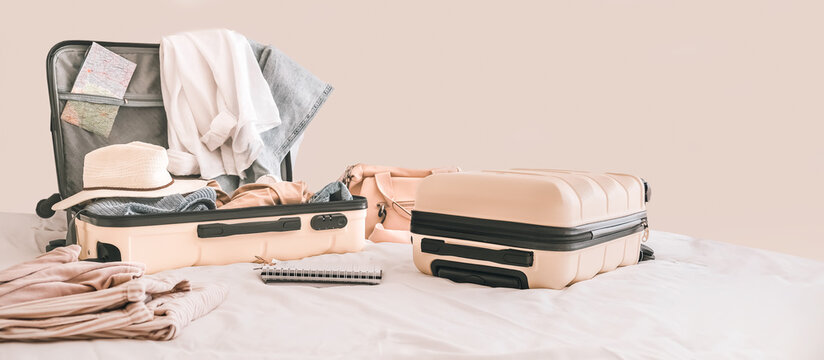 Travel. Staycation.local travel new normal.Girl packing luggage in suitcase and travel documents Travel,tourism,vacation,relocation.Mental health and travel vacation
