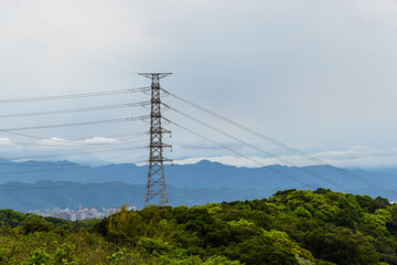High voltage tower with blue sky background