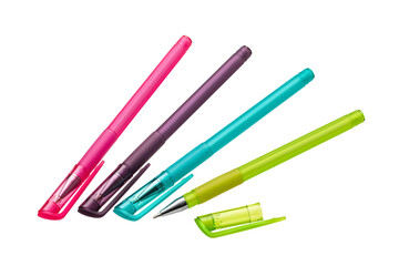 Several bright ballpoint pens of different colors with a closed cap on a white background