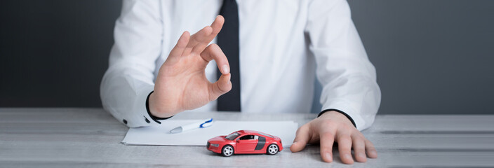 hand ok sign with car model