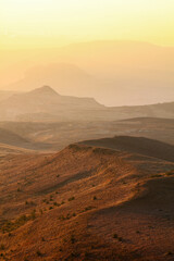 Sunrise over valley looking at the Drakensberg mountains