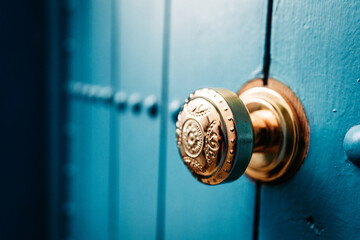 Vibrant blue door with golden knob: A fusion of colors, this door entices with its vibrant blue hue and a touch of elegance from its golden knob.