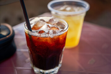 Delicious ice coffee americano on table.