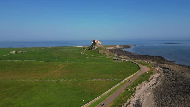 Aerial Video of Lindisfarne, also called Holy Island, and the Holy Island of Lindisfarne, is a tidal island off the northeast coast of England, which constitutes the civil parish of Holy Island