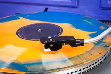 Close up of turntable needle on a vinyl
