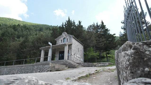 Shot from below with slider, small church in the woods, Castelpetroso, Molise Italy
