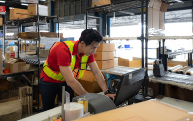 Warehouse staff packing goods for shipping order dispatch. Asian man and manager working in...