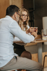 Stylish middle-aged businesspeople taking a break from work. Gorgeous middle-aged businesswoman chatting on her phone
