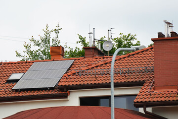 Installing a Solar Cell on a Roof.