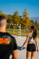 Sporty couple walking and talking