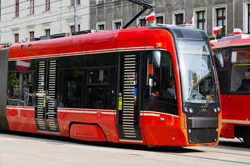 public transport red trams in Poland - obrazy, fototapety, plakaty