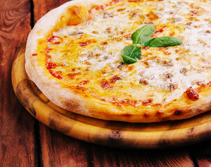 Pizza Margarita on a wooden background