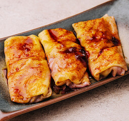 Pancakes with strawberry jam on plate