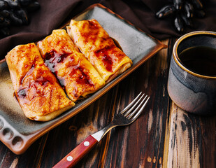 Pancakes with strawberry jam on plate
