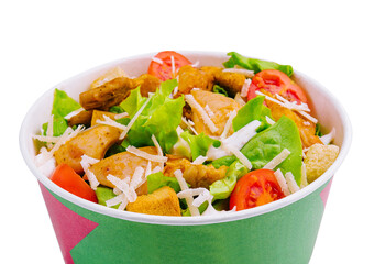 Paper bowl with Caesar salad isolated on white