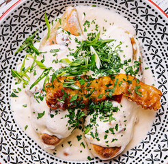 Cepelins or zeppelins with pork and pancetta cracklings © AntAlexStudio