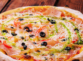 Pizza with cream cheese sauce on wood