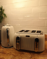 Electric kettle and toaster on kitchen toaster - obrazy, fototapety, plakaty
