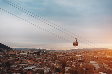 cable car rope way over Georgian capital Tbilisi, aerial of historical district