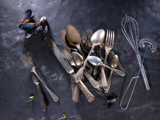 fork , spoon, knife and other silverware on a table