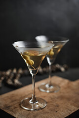 Martini cocktail with green olives
