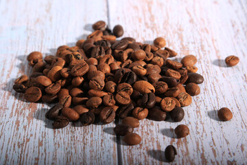 coffee beans on wooden spoon