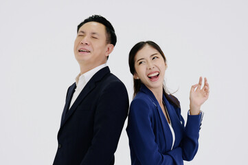 Young businesswoman and young businessman smiling on a white background.