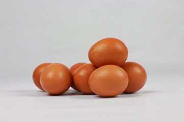 Chicken egg pile on a white background.