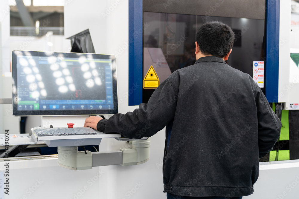 Aufkleber Worker controls automatic machine tool in smart factory.