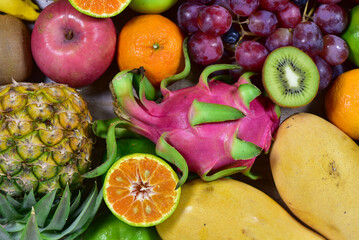 assorted fruits, top view healthy food concept Including high vitamin fruits, fresh fruits, tropical fruits