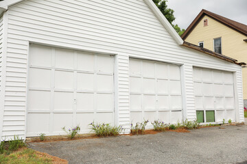 A closed garage door, symbolizing privacy, security, and a barrier between the outside world and...