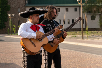 Mexican musician mariachi band on a city street.