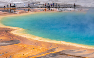 Visitors walked along the elevated path watching the colorful Grand Prismatic Spring, Yellowstone National Park, Wyoming