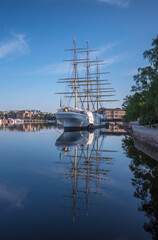 The steel sailing ship af Chapman hostel, reflecting water in the bay Str&ouml;mmen, a sunny summer morning in Stockholm