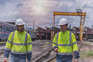 construction workers at work. worker with helmet. Two Engineer stand and sitting on railway inspection. construction worker on railways. Engineer work on Railway. Rail, engineer, Infrastructure.