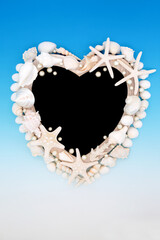 Heart shape seashell and oyster pearl wooden frame on gradient blue and white background with...